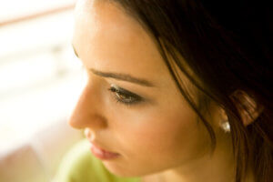 young woman in profile has alcohol use disorder