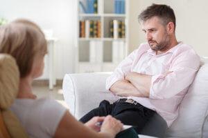 woman talking to man about getting treatment for oxycontin addiction