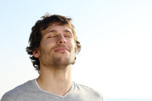 A man breathes fresh air during Pompano Beach rehab