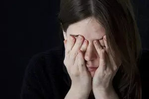 woman with headache suffers from physical dependence